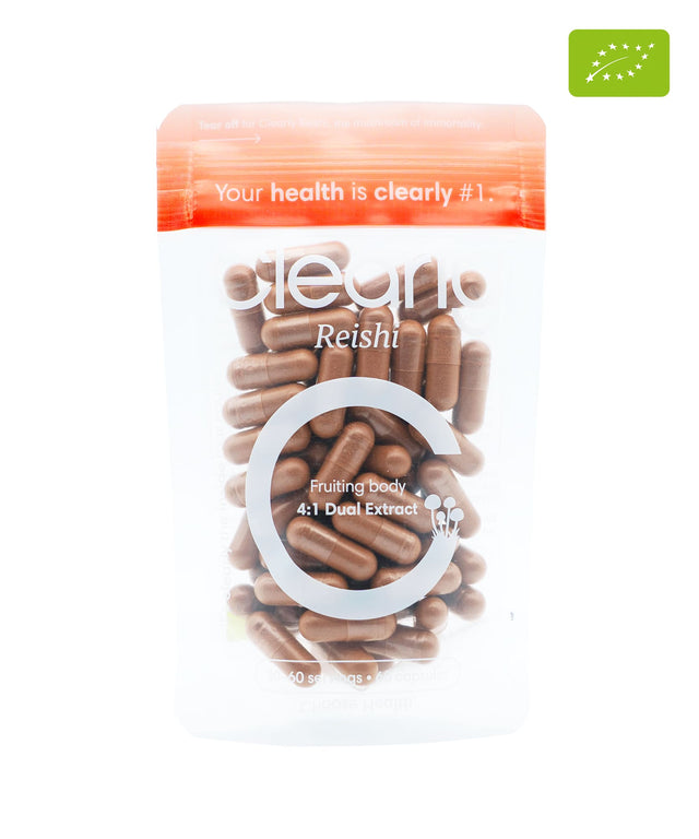 Organic Reishi capsules from Clearly, showing a close-up of the supplement bottle and capsules on a neutral background.